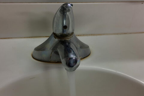 Running water from the tap in the sink