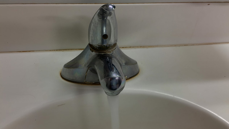 Running water from the tap in the sink